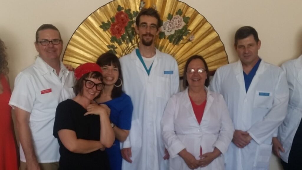 69265658 10217100167548708 195386914222637056 n crop Group of TCM students standing with professor.