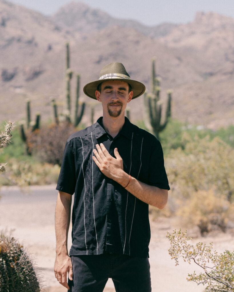 portraits 12 Scott Hillsman with hand on heart.